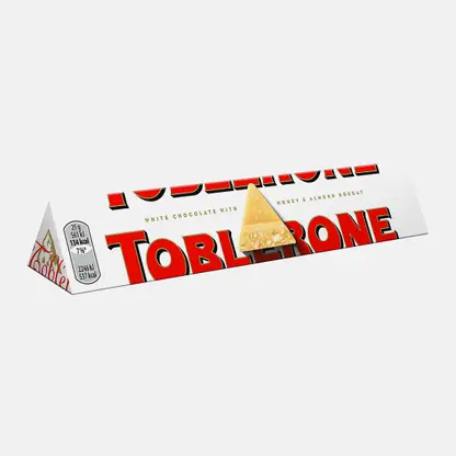 Шоколад белый с медово-миндальной нугой Toblerone 100г